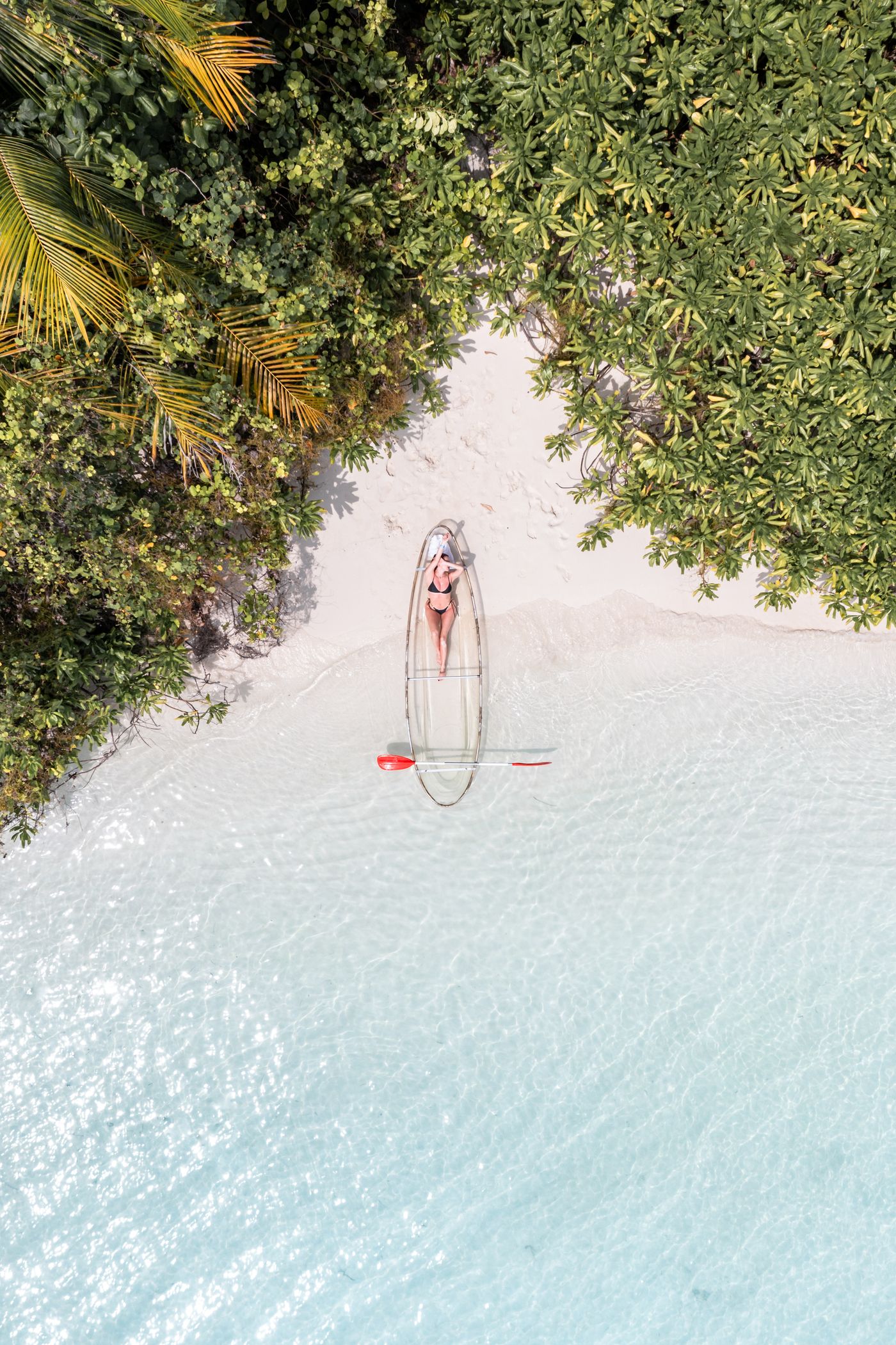 Clear kayak by tropical water