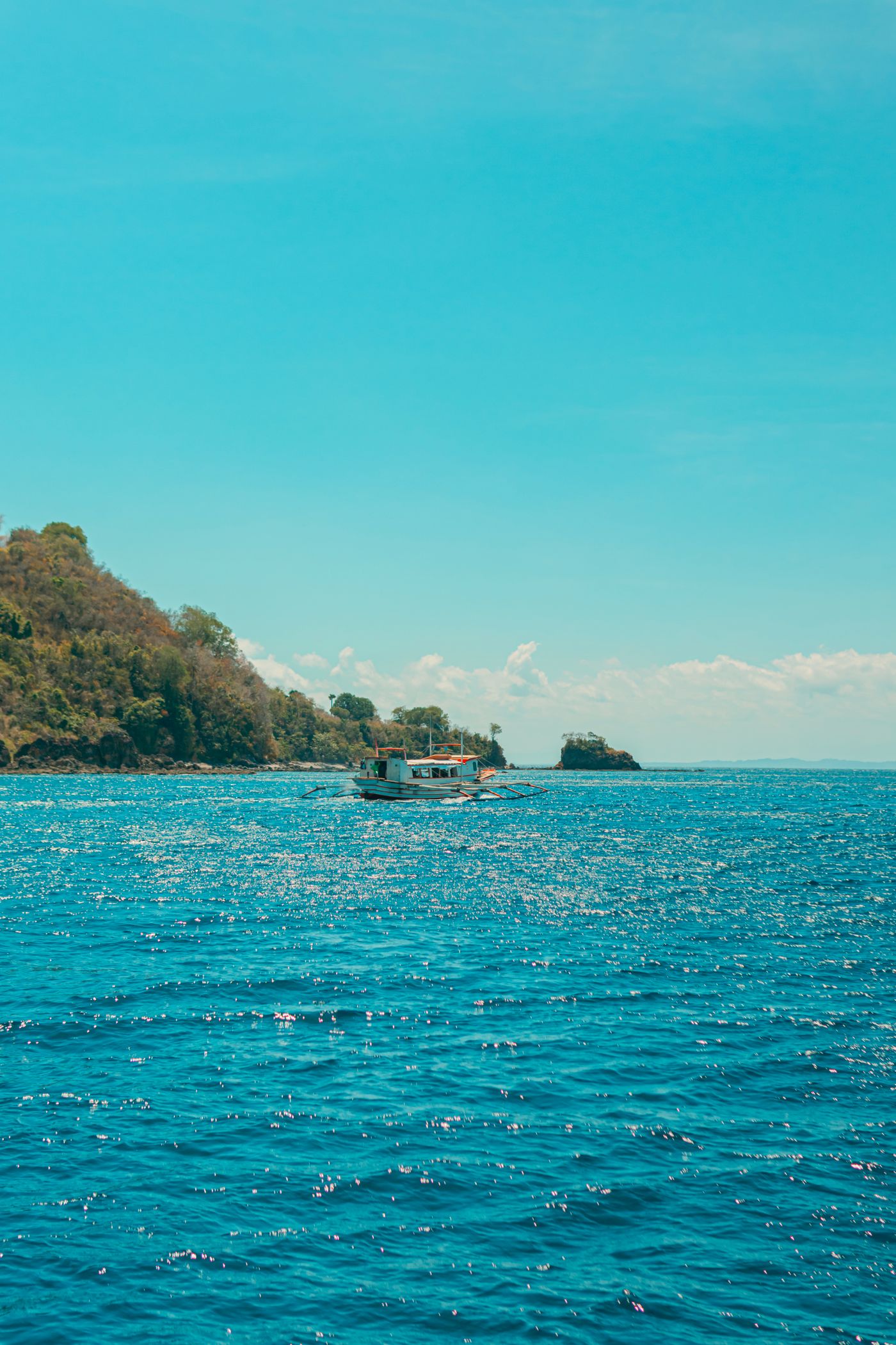 Fishing boat on blue water